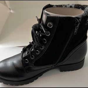 Rugged Outback combat style black lace up boots with printed accent.